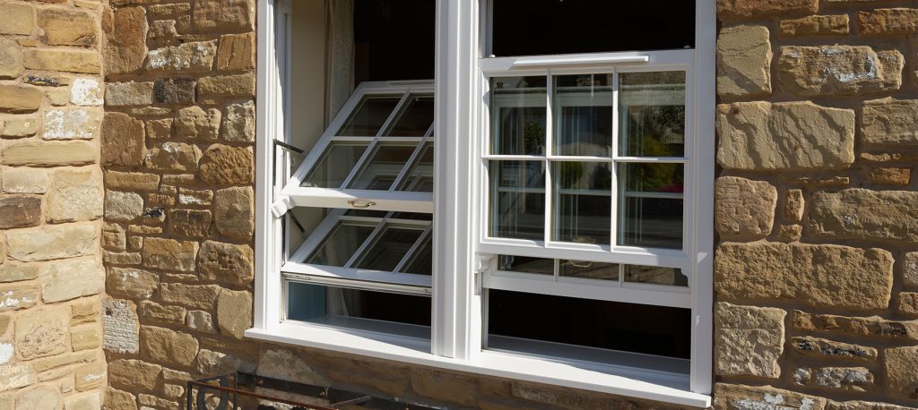Open replacement sash windows Croydon - white framed windows opened on a tilt